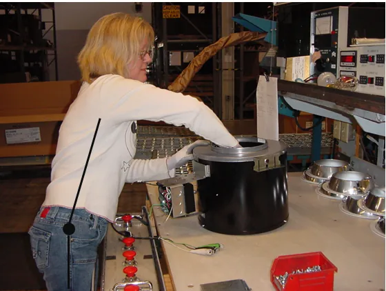 REBA example task: a worker reaching into a large part on a workbench, with a line drawn along the trunk